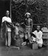 Indonesia: Hat and rug salesmen at a street market in Batavia (Jakarta), c. 1890